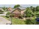 Aerial view of a home with a brick foundation and landscaped backyard at 3601 Lakeshore Ct, Greenwood, IN 46143