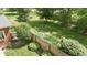 An ample green backyard offers lots of room for activities and outdoor enjoyment at 3601 Lakeshore Ct, Greenwood, IN 46143
