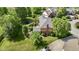 Aerial view of a lush green backyard with a trampoline at 3601 Lakeshore Ct, Greenwood, IN 46143