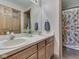 Bathroom featuring double vanity and view of combination shower/tub at 3601 Lakeshore Ct, Greenwood, IN 46143