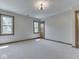 Bedroom with neutral walls, trim and carpet and featuring two windows and a closet at 3601 Lakeshore Ct, Greenwood, IN 46143