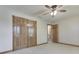 Bedroom features carpet, natural wood trim, and closet doors at 3601 Lakeshore Ct, Greenwood, IN 46143