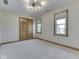 Bedroom with neutral walls, carpet and trim featuring two windows and a closet at 3601 Lakeshore Ct, Greenwood, IN 46143