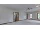 Spacious bonus room features neutral carpeting, recessed lighting, and access to kitchen at 3601 Lakeshore Ct, Greenwood, IN 46143