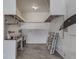 Interior of a garage featuring storage, cabinets, and a utility sink at 3601 Lakeshore Ct, Greenwood, IN 46143