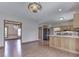 Spacious eat-in kitchen with hardwood floor, wooden cabinets, stainless steel appliances, and lovely lighting fixtures at 3601 Lakeshore Ct, Greenwood, IN 46143