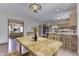 Staged eat-in kitchen with hardwood floor, wooden cabinets, stainless steel appliances, table and chairs at 3601 Lakeshore Ct, Greenwood, IN 46143
