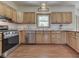 Bright kitchen featuring stainless steel appliances, wood cabinets, granite countertop and hardwood floor at 3601 Lakeshore Ct, Greenwood, IN 46143