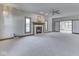 Spacious living room with neutral carpet, a charming fireplace, and lots of natural light at 3601 Lakeshore Ct, Greenwood, IN 46143