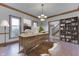 Office features an antique wooden desk, decorative rug, and built in shelving at 3601 Lakeshore Ct, Greenwood, IN 46143