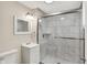 Bathroom featuring vanity, toilet, and tiled shower with sliding glass door at 364 Congress Ave, Indianapolis, IN 46208