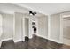 Bedroom with closet, modern fan, and view into tiled bathroom and kitchen at 364 Congress Ave, Indianapolis, IN 46208