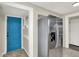 Bright kitchen featuring stainless steel refrigerator and a blue pantry door at 364 Congress Ave, Indianapolis, IN 46208