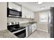 Modern kitchen featuring granite countertops, stainless steel appliances, and ample cabinet space at 364 Congress Ave, Indianapolis, IN 46208