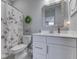 Bathroom featuring a stylish vanity with a quartz countertop, toilet, and a shower with curtain at 3697 Chalmers Dr, Bargersville, IN 46106