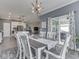 Bright dining room with a view to the living room, open floor plan, and outdoor access at 3697 Chalmers Dr, Bargersville, IN 46106