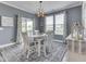 Charming dining room filled with lots of natural light, stylish rug, and neutral decor at 3697 Chalmers Dr, Bargersville, IN 46106