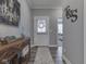 Inviting foyer features hardwood floors, elegant decor, and seamless transition to the adjacent living spaces at 3697 Chalmers Dr, Bargersville, IN 46106