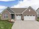 Charming brick home with a well-manicured lawn and a two-car garage, perfect for suburban living at 3697 Chalmers Dr, Bargersville, IN 46106