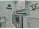 Bright laundry room with modern washer and dryer, ample storage, and decorative touches at 3697 Chalmers Dr, Bargersville, IN 46106