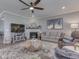 Spacious living room features a fireplace, stylish decor, comfortable seating, and ample natural light at 3697 Chalmers Dr, Bargersville, IN 46106