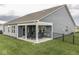 Inviting outdoor patio with comfortable seating and a view of the green backyard at 3697 Chalmers Dr, Bargersville, IN 46106