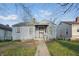 Modest single-story home with a covered entry, ready for renovation and personalization at 3706 Baltimore Ave, Indianapolis, IN 46218
