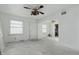 Living room featuring bright white walls, multiple windows, and an open archway to other rooms at 3706 Baltimore Ave, Indianapolis, IN 46218