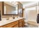 Bathroom with dual sinks, wooden cabinets and a shower/tub combo with tile surround at 3808 Brigade Cir, Carmel, IN 46032