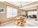 Elegant dining area featuring a chandelier, natural light, and stylish seating at 3808 Brigade Cir, Carmel, IN 46032
