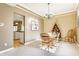 Inviting dining area with hardwood table and view into the kitchen space at 3808 Brigade Cir, Carmel, IN 46032