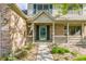 Close up of a charming front porch and entry way with detailed brickwork at 3808 Brigade Cir, Carmel, IN 46032