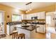 Charming kitchen featuring white cabinetry, stainless steel appliances, and center island at 3808 Brigade Cir, Carmel, IN 46032
