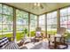 Bright sunroom featuring many windows and comfortable seating with outdoor views at 3808 Brigade Cir, Carmel, IN 46032