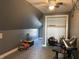Attic bonus space with sloped ceilings, ceiling fan, and natural light perfect for recreational activities or storage at 40 N Park Ave, Martinsville, IN 46151