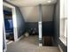 This attic bonus space features sloped ceilings, carpet, and natural light at 40 N Park Ave, Martinsville, IN 46151