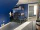 A bright bedroom with a loft bed and desk provides an excellent space to play and work at 40 N Park Ave, Martinsville, IN 46151