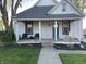Charming home with a welcoming front porch and well-manicured lawn at 40 N Park Ave, Martinsville, IN 46151