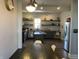 Spacious kitchen featuring open shelving, stainless steel appliances, and a kitchen island at 40 N Park Ave, Martinsville, IN 46151