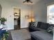 Comfortable living room with a gray sectional, leading into a well-equipped kitchen at 40 N Park Ave, Martinsville, IN 46151
