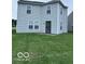 This backyard features a grassy area and a door to the home at 4070 Presidio Cir, Indianapolis, IN 46235