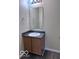 This bathroom features a vanity, wood-look flooring, and a mirror at 4070 Presidio Cir, Indianapolis, IN 46235