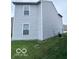 The back exterior shows light gray siding and a well-maintained lawn at 4070 Presidio Cir, Indianapolis, IN 46235
