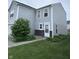 Charming two-story home with light gray siding, a white front door, and manicured lawn at 4070 Presidio Cir, Indianapolis, IN 46235