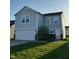Charming two-story home with attached garage and well-maintained front lawn at 4070 Presidio Cir, Indianapolis, IN 46235