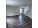 Spacious living room featuring hardwood flooring and natural light at 4070 Presidio Cir, Indianapolis, IN 46235