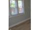 Bright bedroom features fresh paint, new floors and a large window at 4736 Madison Ave, Indianapolis, IN 46227