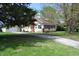 Charming home with well-maintained yard, garage, and quaint side porch at 4736 Madison Ave, Indianapolis, IN 46227