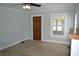 Comfortable living room offers updated flooring, fresh paint and ample natural light at 4736 Madison Ave, Indianapolis, IN 46227