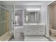 Bright bathroom featuring a double sink vanity, shower, toilet, and modern finishes at 4759 Silver Hill Dr, Greenwood, IN 46142